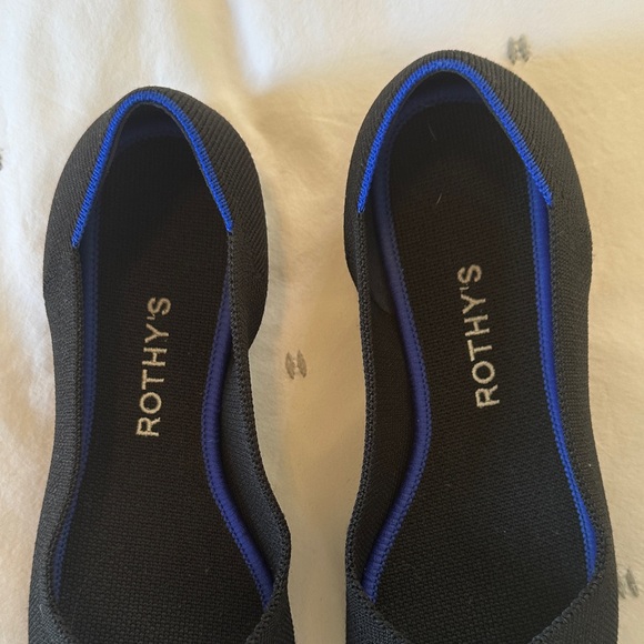 Rothy's Elegant Black Flats with Vibrant Blue Accent - Picture 2 of 6